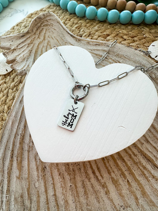Necklace with a rectangle pendant that is laser engraved with Hockey Mom